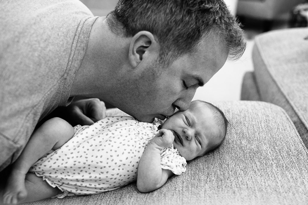 dad kissing his little girl