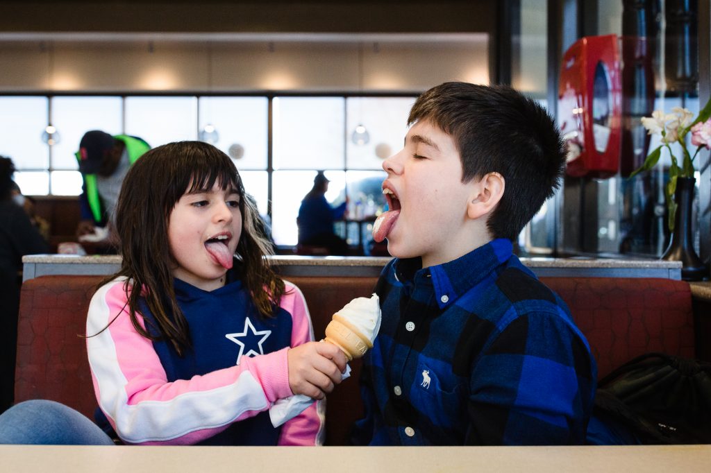 Children sharing ice cream