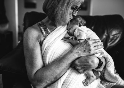 grandma kissing her grandchild