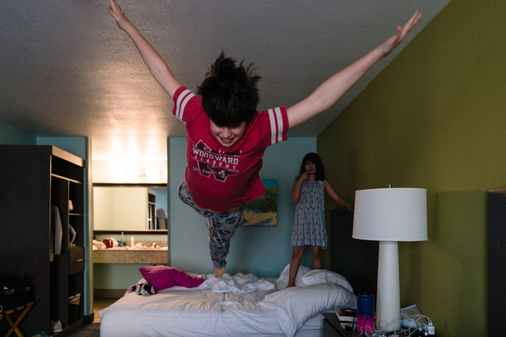 kid jumping to bed